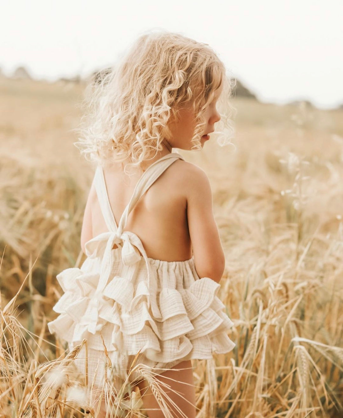 Rainbow ruffle romper